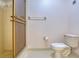 Simple bathroom featuring tile floors, glass shower enclosure, and standard toilet at 700 Starkey Rd # 1145, Largo, FL 33771