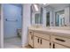 Bathroom featuring a vanity with storage and a sink with a large mirrored medicine cabinet at 700 Starkey Rd # 1145, Largo, FL 33771