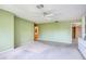 Green bedroom with carpet and entrance to the bathroom with dual sinks and shower at 700 Starkey Rd # 1145, Largo, FL 33771