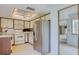 Bright kitchen with white cabinets, stainless steel appliances, and an open layout at 700 Starkey Rd # 1145, Largo, FL 33771