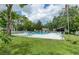 Large community pool area surrounded by lush greenery and beautiful landscaping at 700 Starkey Rd # 1145, Largo, FL 33771