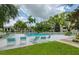 Community pool area with many seats around the pool and buildings in the background at 700 Starkey Rd # 1145, Largo, FL 33771