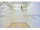 Walk-in closet with built-in wire shelving and neutral carpet at 700 Starkey Rd # 1145, Largo, FL 33771