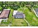 Aerial view showcasing the home's well-maintained lawn, deck, and proximity to neighboring properties at 812 W Orient St, Tampa, FL 33603