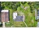Birds eye view displaying the property's layout, including the yard, deck, and surrounding greenery at 812 W Orient St, Tampa, FL 33603