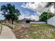 This large fenced backyard has ample space, ideal for outdoor activities and entertaining at 8200 Westfield Dr, Port Richey, FL 34668