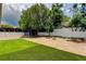 Spacious backyard with green turf and shed, perfect for outdoor activities and storage at 8200 Westfield Dr, Port Richey, FL 34668