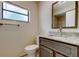 Bathroom featuring a granite vanity, updated fixtures, and natural light at 8200 Westfield Dr, Port Richey, FL 34668