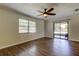 This bedroom offers tile floors, crown molding, a ceiling fan and sliding glass doors to the patio at 8200 Westfield Dr, Port Richey, FL 34668