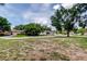 Expansive front yard offering ample space and a picturesque neighborhood view at 8200 Westfield Dr, Port Richey, FL 34668