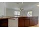Kitchen features stainless steel appliances, double sink, granite counters, and breakfast bar at 8200 Westfield Dr, Port Richey, FL 34668
