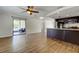 Spacious living room with tile floors, sliding glass doors to the patio, and eat-in kitchen at 8200 Westfield Dr, Port Richey, FL 34668