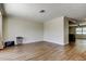 A bright and open living space featuring sleek wood-look tile flooring and a neutral color palette at 8200 Westfield Dr, Port Richey, FL 34668