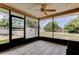 Enjoy outdoor living in this screened patio with tiled floor and views of the surrounding neighborhood at 8200 Westfield Dr, Port Richey, FL 34668