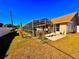 Lush backyard featuring a sunroom, perfect for outdoor activities and enjoying the serene surroundings at 8616 Pinafore Dr, New Port Richey, FL 34653