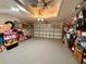 Spacious garage with ample storage and organization, providing parking and extra space for hobbies at 8616 Pinafore Dr, New Port Richey, FL 34653
