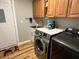 Functional laundry room with modern appliances and ample storage at 8616 Pinafore Dr, New Port Richey, FL 34653