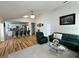 Bright and open living space with hardwood floors and a seamless flow into the kitchen area at 8616 Pinafore Dr, New Port Richey, FL 34653