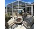 Charming outdoor patio with cozy seating and a fire pit, perfect for entertaining guests or relaxing outdoors at 8616 Pinafore Dr, New Port Richey, FL 34653