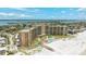Expansive beachfront condo complex featuring private beach access, pool, and views of the ocean and cityscape at 880 Mandalay Ave # C512, Clearwater Beach, FL 33767