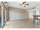 Bright living area with tile floors, sliding glass doors to the balcony and breakfast bar at 880 Mandalay Ave # C512, Clearwater Beach, FL 33767