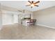 Open-concept living space featuring tile flooring, a breakfast bar, and a cozy atmosphere at 880 Mandalay Ave # C512, Clearwater Beach, FL 33767