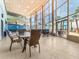 Bright and open lobby with large windows offering ocean views and tiled flooring at 880 Mandalay Ave # C512, Clearwater Beach, FL 33767