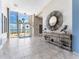 Inviting lobby with tiled flooring, artwork, ocean views and secured entry at 880 Mandalay Ave # C512, Clearwater Beach, FL 33767