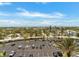 Expansive parking lot with neatly arranged spaces and palm trees, offering scenic neighborhood views at 880 Mandalay Ave # C512, Clearwater Beach, FL 33767