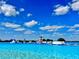 A view of the incredible aqua park filled with inflatable structures, against a blue, cloudy sky at 10702 Laxer Cay Loop, San Antonio, FL 33576