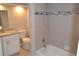 Bathroom with a tiled tub surround, extended vanity and updated fixtures at 11227 Thicket Ct, Tampa, FL 33624