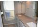 Bathroom showcasing dual sinks, large counter space and a window for natural light at 11227 Thicket Ct, Tampa, FL 33624