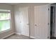Bedroom with durable flooring, neutral paint, and a window for natural light at 11227 Thicket Ct, Tampa, FL 33624