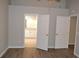 Bedroom with wood floors and a view of the bathroom and closet at 11227 Thicket Ct, Tampa, FL 33624