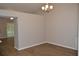 Dining room with wood-look floors, modern lighting, and a spacious layout for gatherings at 11227 Thicket Ct, Tampa, FL 33624
