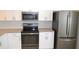 Well-equipped kitchen with modern appliances, ample counter space, and white cabinetry for a functional design at 11227 Thicket Ct, Tampa, FL 33624
