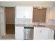 Contemporary kitchen with stainless steel appliances, white cabinets, and modern hardware for a stylish design at 11227 Thicket Ct, Tampa, FL 33624