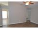 Living room with wood-look floors and a glimpse into adjacent rooms at 11227 Thicket Ct, Tampa, FL 33624