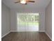 Neutral living room with wood floors, and sliding doors at 11227 Thicket Ct, Tampa, FL 33624