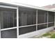Exterior of a screened-in back patio at 11227 Thicket Ct, Tampa, FL 33624