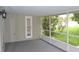 Screened-in back patio has an outdoor lighting fixture at 11227 Thicket Ct, Tampa, FL 33624