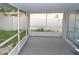 Enclosed back patio offers outdoor living space at 11227 Thicket Ct, Tampa, FL 33624