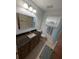Well-lit bathroom features a granite-topped vanity, tiled floor, and a tub with shower at 11308 Echo View Dr, Odessa, FL 33556