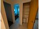 Bathroom with sink and toilet, plus open door to hallway closet at 11308 Echo View Dr, Odessa, FL 33556