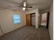 Cozy bedroom with a ceiling fan, closet, and neutral carpet at 11308 Echo View Dr, Odessa, FL 33556
