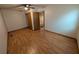 A bright bedroom featuring wood floors and a ceiling fan at 11308 Echo View Dr, Odessa, FL 33556