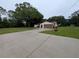 A house with a well-maintained front lawn and an extra-long driveway leading to an attached two-car garage at 11308 Echo View Dr, Odessa, FL 33556