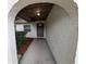 Inviting arched entrance showcasing a beautifully textured exterior and modern front door at 11308 Echo View Dr, Odessa, FL 33556