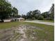 Spacious front yard leading to a well-maintained single-Gathering home with an attached garage and ample parking space at 11308 Echo View Dr, Odessa, FL 33556