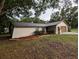 Charming single-story home with a stucco facade, well-manicured landscaping, and a two-car garage, exuding curb appeal at 11308 Echo View Dr, Odessa, FL 33556
